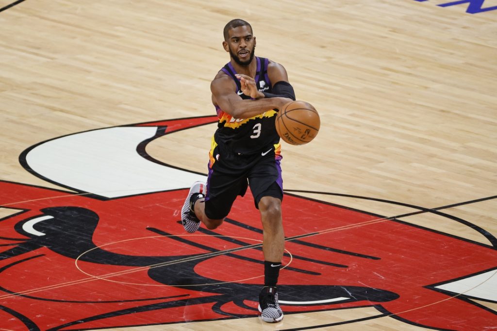 Feb 26, 2021; Chicago, Illinois, USA; Phoenix Suns guard Chris Paul (3) passes the ball against the Chicago Bulls during the first half of an NBA game at United Center. Mandatory Credit: Kamil Krzaczynski-USA TODAY Sports